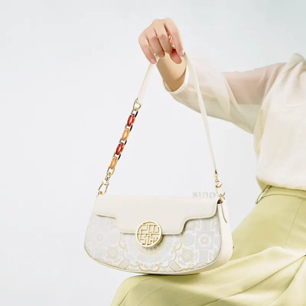 model-holding-octagonal-brocade-bag-seated model-holding-octagonal-brocade-bag-seated