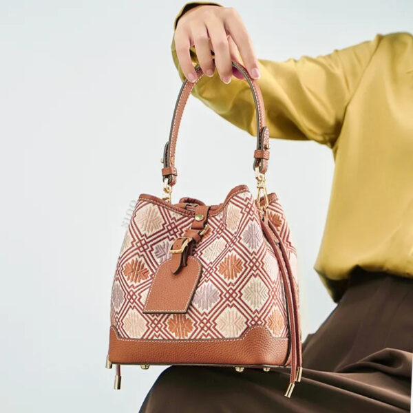 model-seated-brocade-bucket-bag-on-knees model-seated-brocade-bucket-bag-on-knees