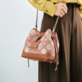 model-wearing-brocade-bucket-bag-shoulder