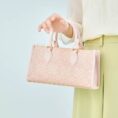 song-brocade-leather-handbag-pink-gold-dingsheng-motif-model-handheld